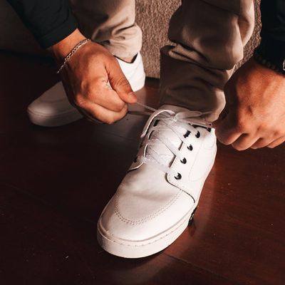 A person's feet in comfortable trainers, ready for movement.