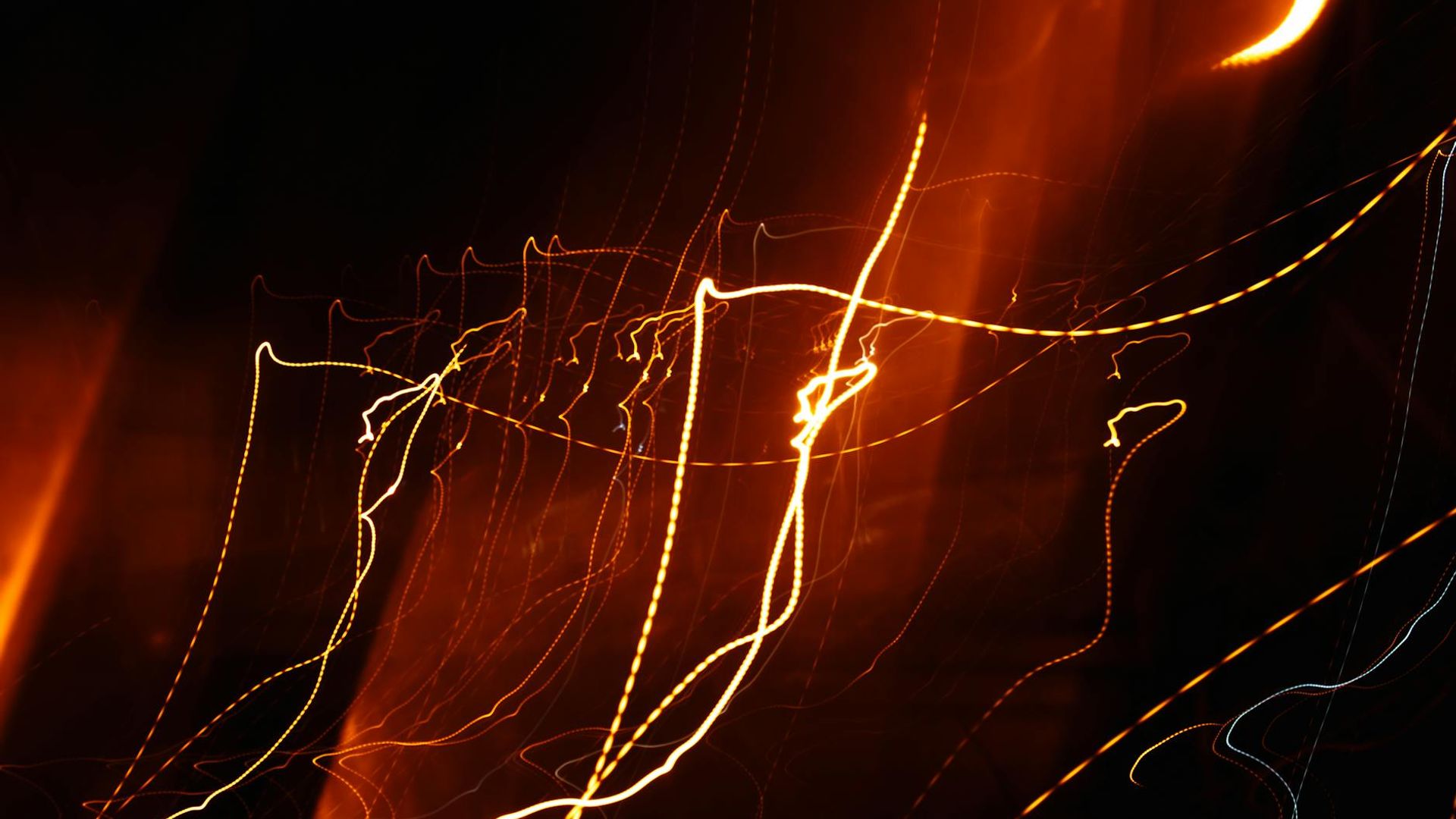 Abstract representation of rhythmic energy flow with cyan light trails on a dark background.